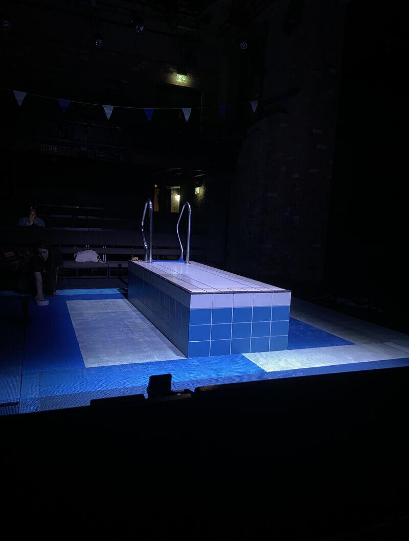 A small stage designed to look like a swimming pool